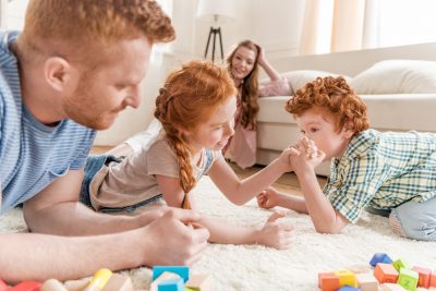 brother-sister-arm-wrestle-dp - Living On The Cheap