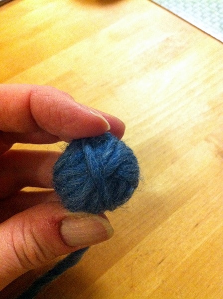 wool dryer ball step four continue wrapping 100% wool yarn around until larger than tennis ball