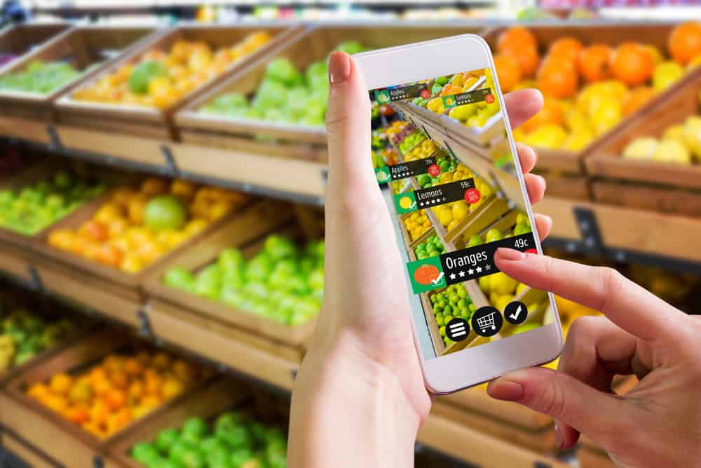 Closeup of grocery shopper using app on smartphone.