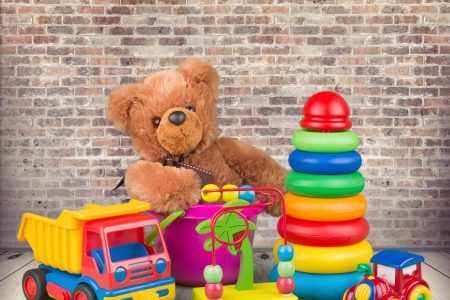 toys including teddy bear, stackable rings and truck