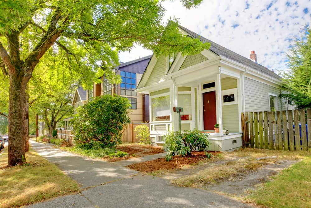 Buying a home - Small cute craftsman American house wth green and white