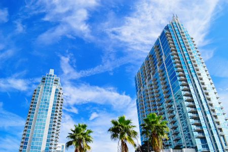 Florida luxury condo with palm trees by the water