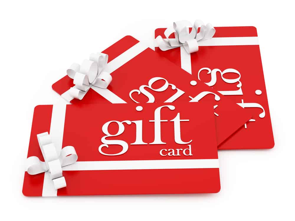 Red gift cards with white ribbons, with texting saying "gift card"