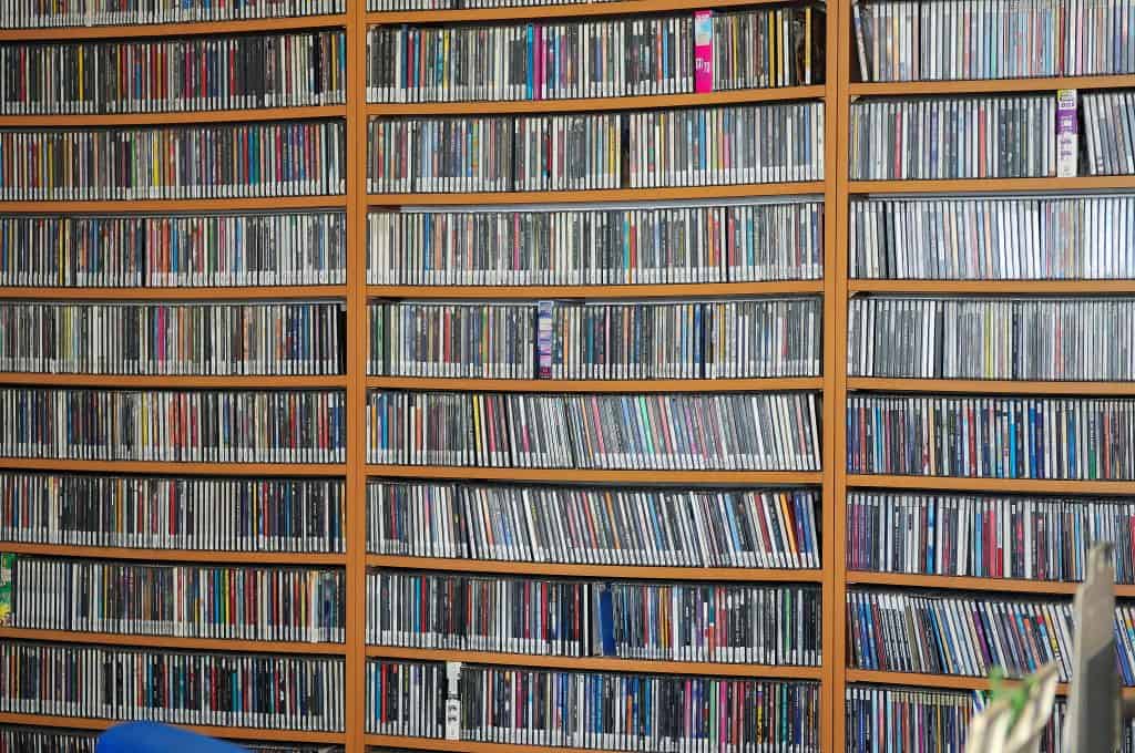 A wall of bookshelves filled with DVD cases.