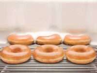 closeup of six Krispy Kreme original glazed donuts