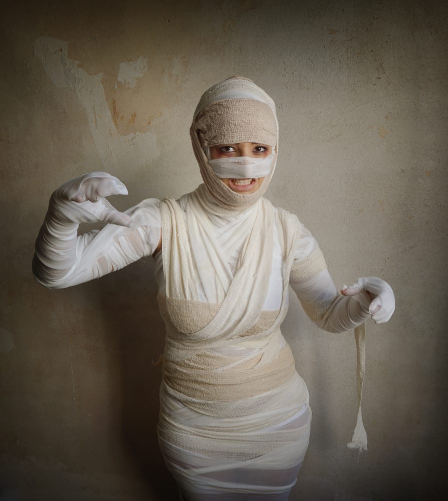 Person in a DIY mummy costume - cheap and easy Halloween costume idea using things you have at home
