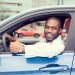 Save money on gas - Black man in blue car giving thumbs up
