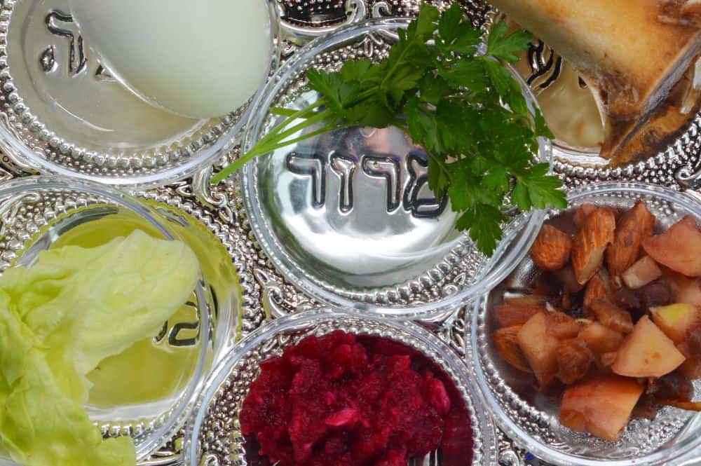 Closeup of items on Passover table in small dishes.