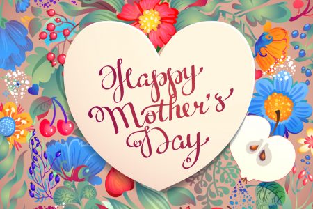 Wooden heart with red script Happy Mother's Day on floral backdrop