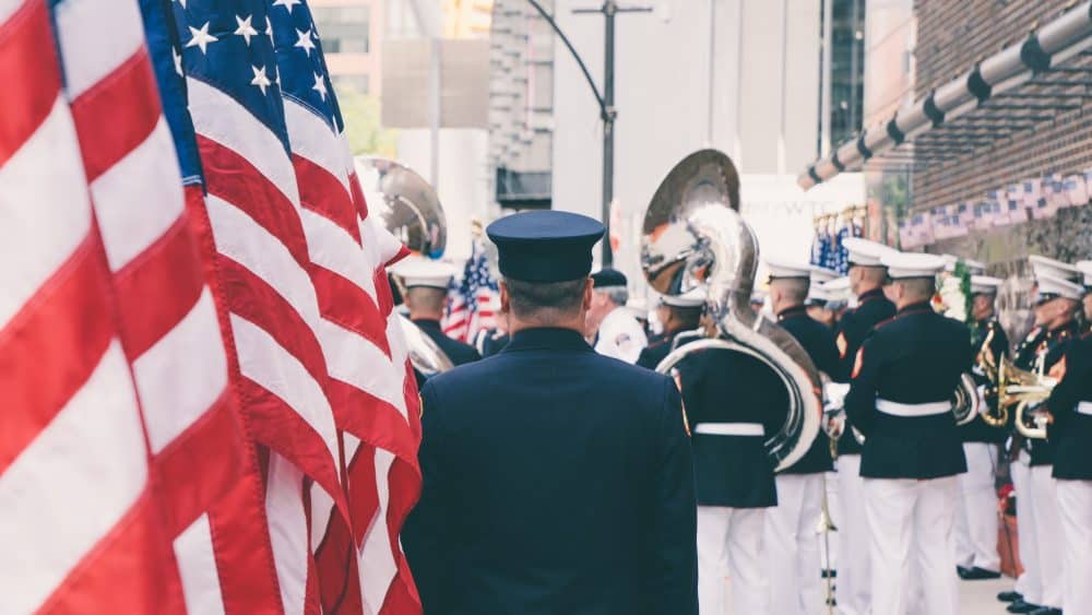 a military band with american flags nearby