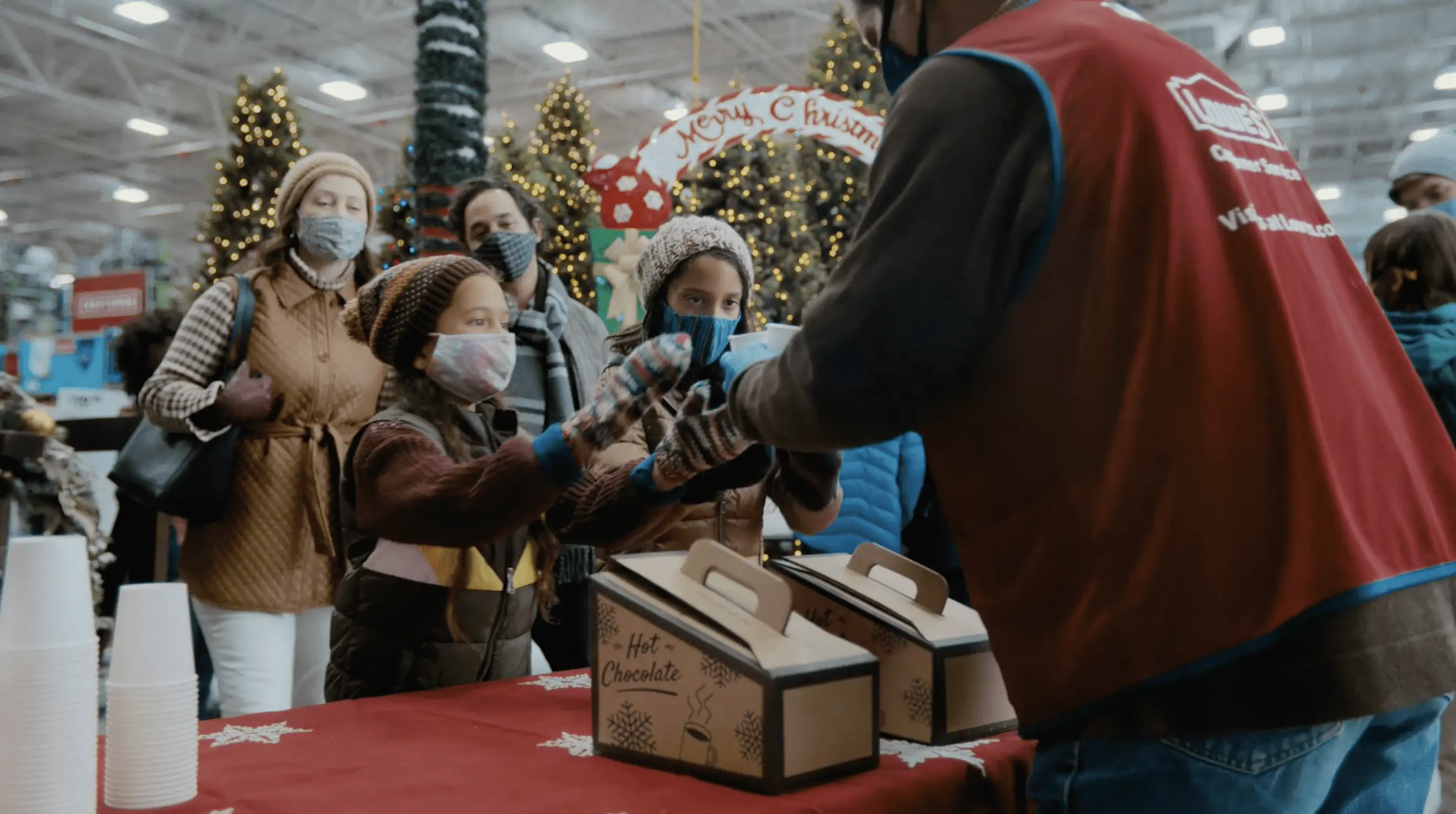 Children getting free cocoa at Lowe's Wintervest.