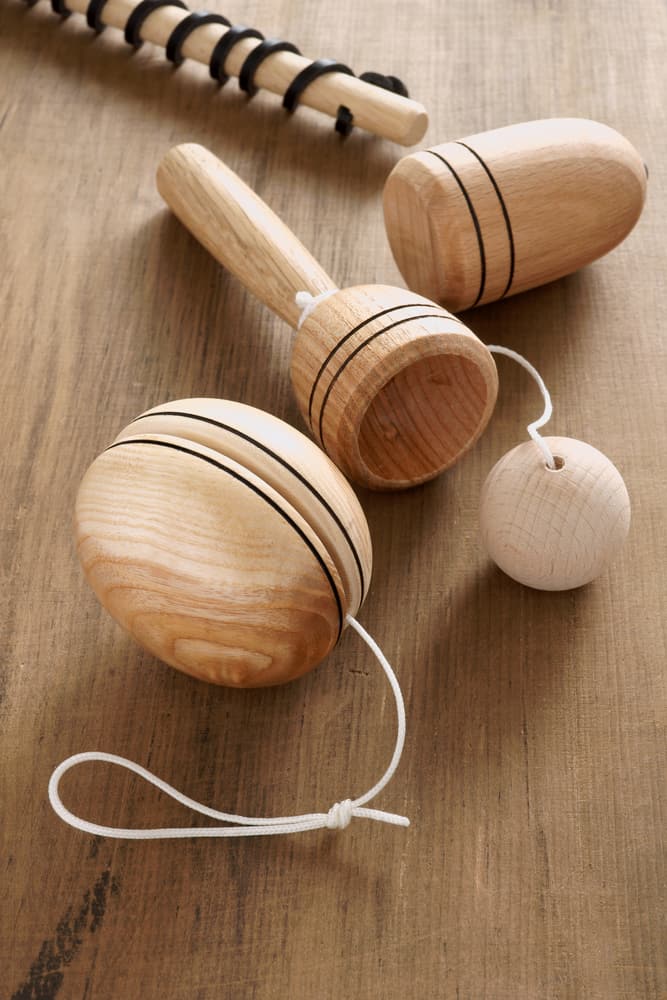 No-tech toys include a wooden yo-yo and ball and cup