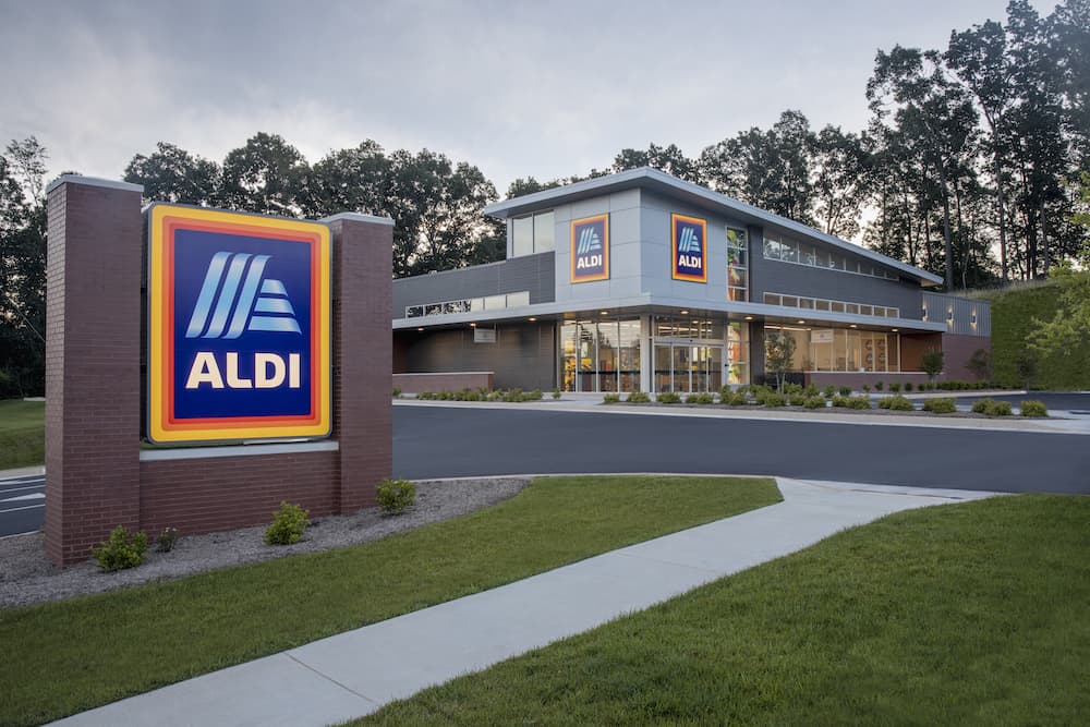 Front of ALDI discount grocery store with sign