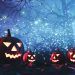 Illustration of jack-o'lanterns in forest withe blue background and white lights.